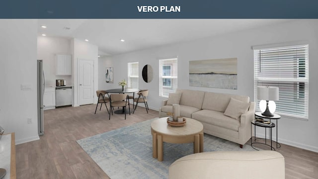 living room featuring light hardwood / wood-style floors and lofted ceiling