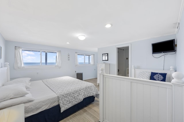 bedroom featuring light wood-style flooring, recessed lighting, and baseboards