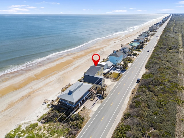 aerial view with a beach view and a water view