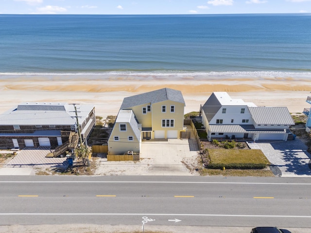 bird's eye view featuring a beach view and a water view