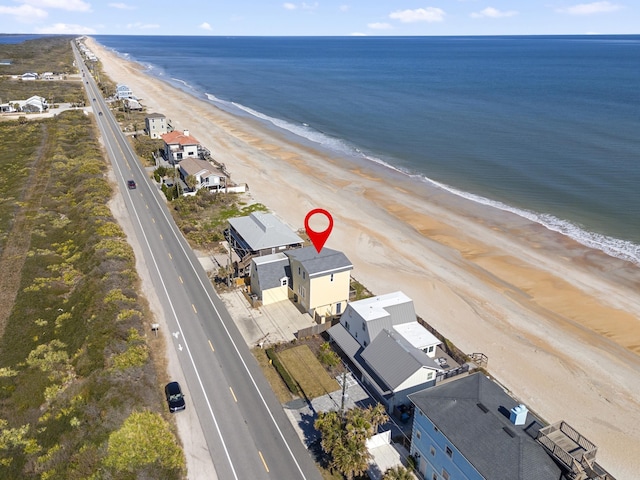 aerial view featuring a water view and a beach view