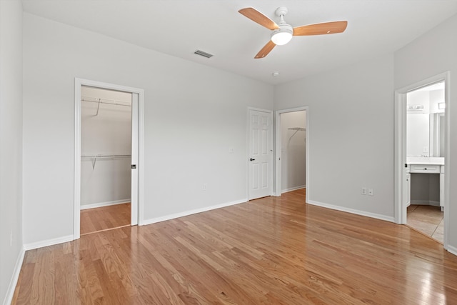 4515 Serena Cir, Saint Augustine, FL 32084 - unfurnished bedroom with baseboards, visible vents, a spacious closet, and light wood-type flooring