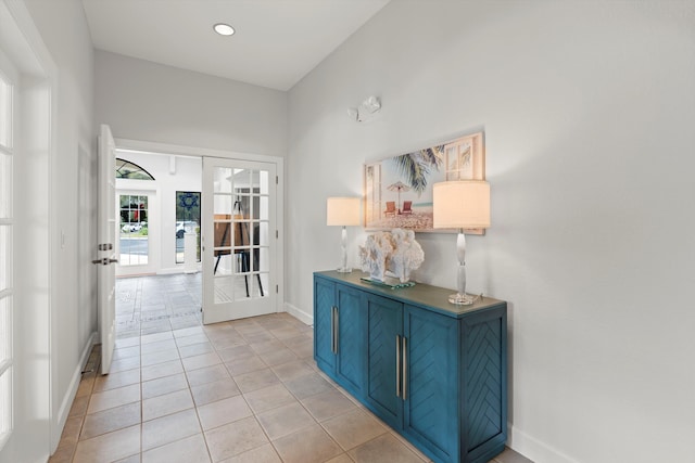 4515 Serena Cir, Saint Augustine, FL 32084 - corridor with light tile patterned flooring, baseboards, and french doors