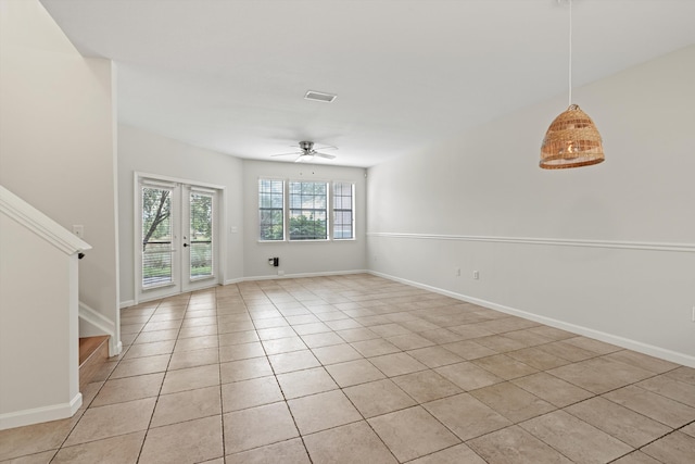 4515 Serena Cir, Saint Augustine, FL 32084 - unfurnished living room with light tile patterned floors, baseboards, stairway, and ceiling fan