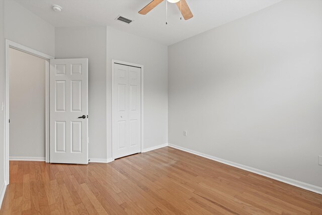 4515 Serena Cir, Saint Augustine, FL 32084 - unfurnished bedroom with a closet, light wood-style flooring, baseboards, visible vents, and ceiling fan