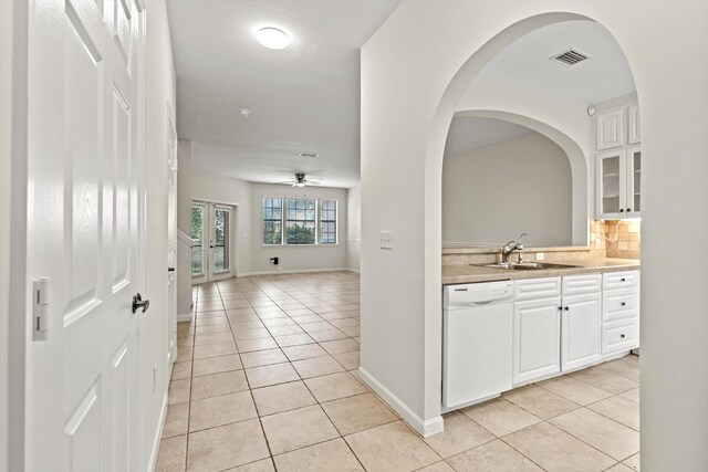 4515 Serena Cir, Saint Augustine, FL 32084 - interior space featuring baseboards, a sink, arched walkways, light tile patterned flooring, and visible vents
