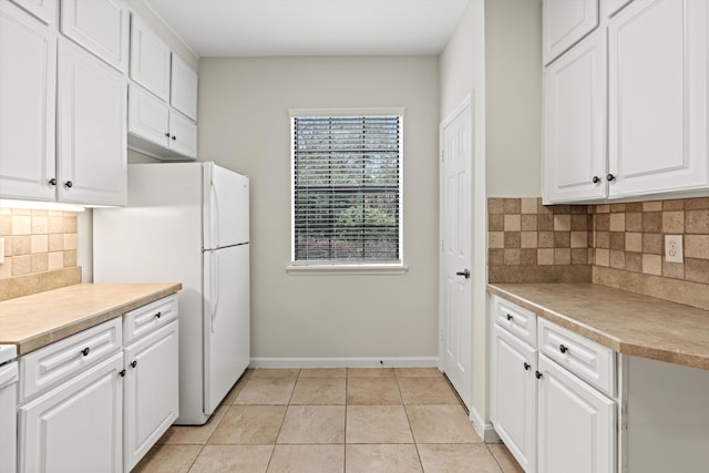 4515 Serena Cir, Saint Augustine, FL 32084 - kitchen with white cabinetry, light countertops, and light tile patterned floors