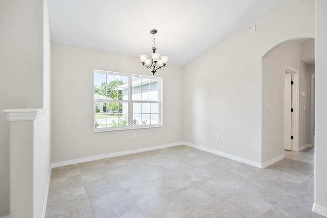 empty room with an inviting chandelier