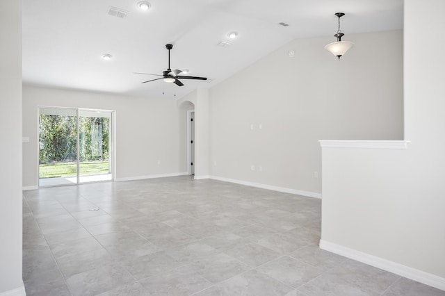 spare room with vaulted ceiling, ceiling fan, and light tile patterned flooring