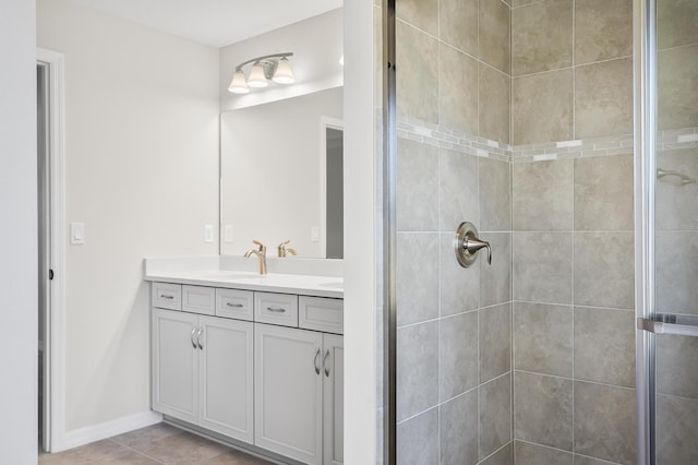 bathroom with vanity, tile patterned floors, and a shower with shower door