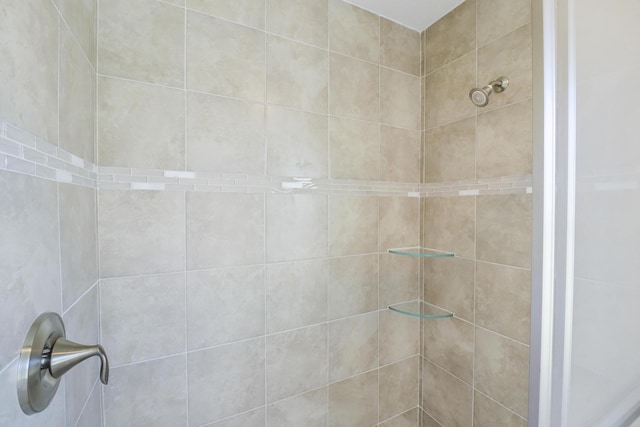 bathroom with tiled shower