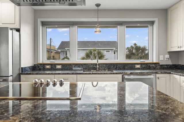 kitchen with white cabinetry, sink, plenty of natural light, and appliances with stainless steel finishes