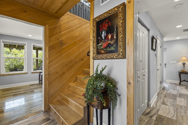 stairway featuring hardwood / wood-style floors