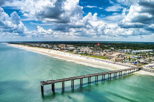 drone / aerial view with a view of the beach and a water view