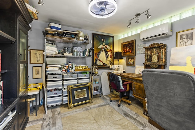 office featuring an AC wall unit and ceiling fan