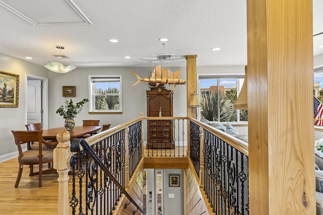 interior space with hardwood / wood-style floors and a textured ceiling