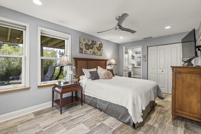 bedroom with hardwood / wood-style floors, a textured ceiling, a closet, and ceiling fan