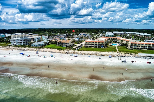 bird's eye view with a water view and a view of the beach