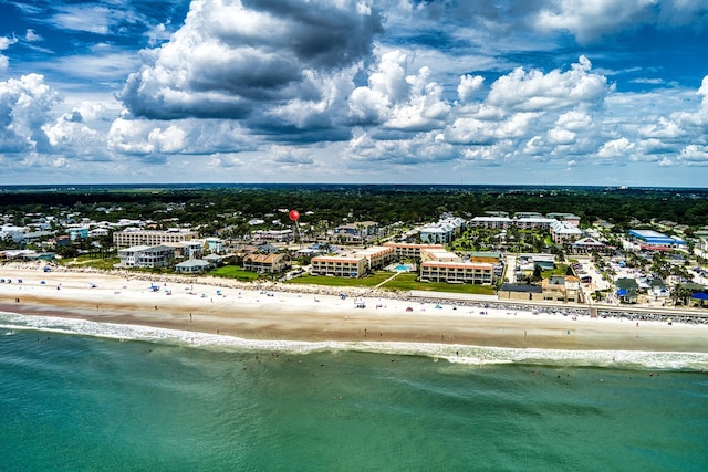 bird's eye view featuring a view of the beach and a water view