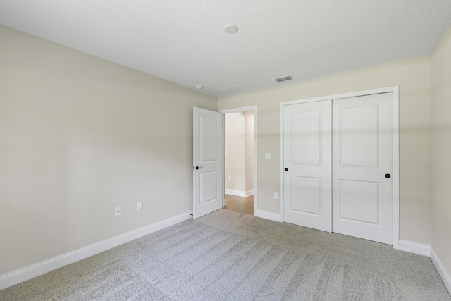 45 Laguna Forest Trl, Palm Coast, FL 32164 - unfurnished bedroom featuring carpet flooring, baseboards, and a closet