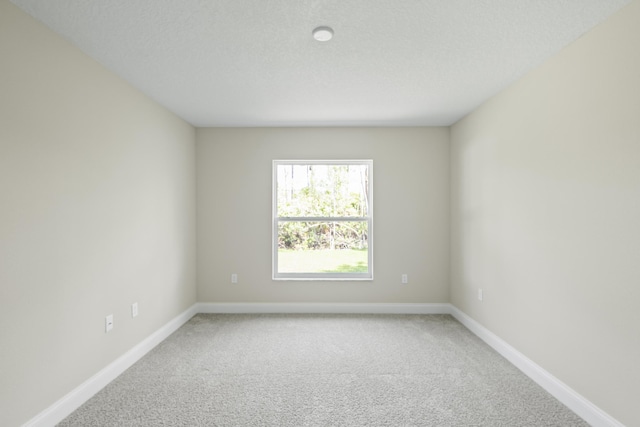 45 Laguna Forest Trl, Palm Coast, FL 32164 - carpeted empty room featuring baseboards