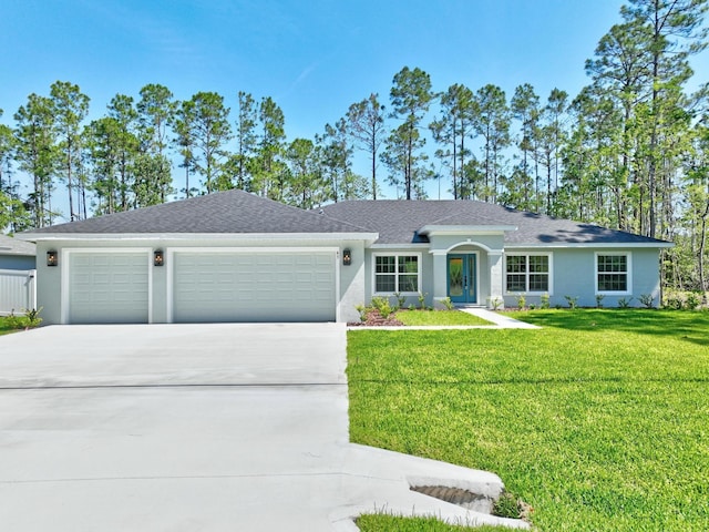 45 Laguna Forest Trl, Palm Coast, FL 32164 - ranch-style home with an attached garage, driveway, a front lawn, and stucco siding