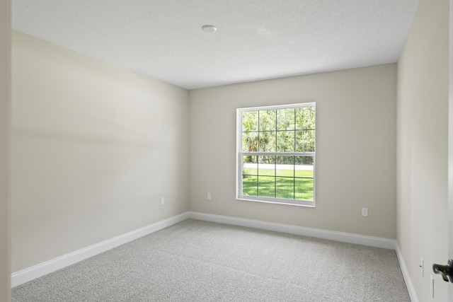 45 Laguna Forest Trl, Palm Coast, FL 32164 - carpeted empty room featuring baseboards