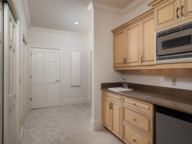 kitchen featuring light colored carpet, stainless steel appliances, crown molding, and sink