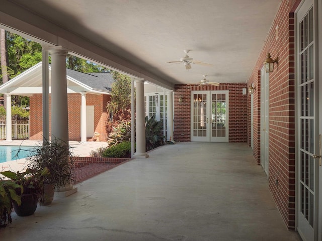 view of patio featuring ceiling fan and french doors