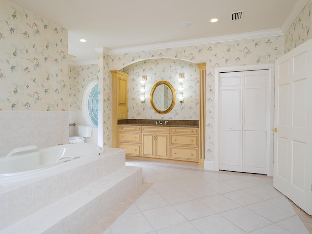 bathroom featuring tile patterned floors, a relaxing tiled tub, crown molding, and vanity