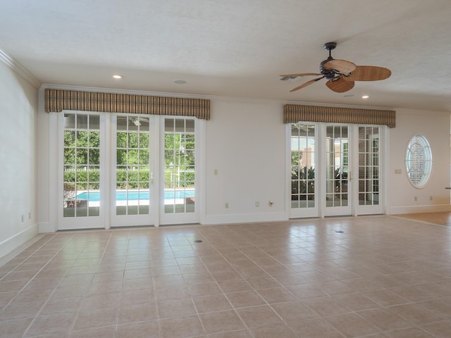 tiled empty room with a textured ceiling, ceiling fan, and crown molding