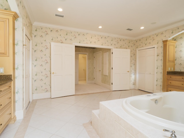 bathroom featuring tile patterned floors, vanity, ornamental molding, and tiled bath