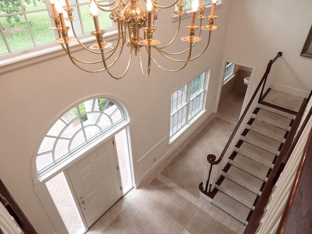 entrance foyer with a chandelier