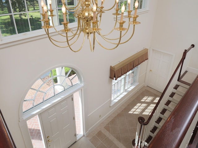 foyer featuring a chandelier