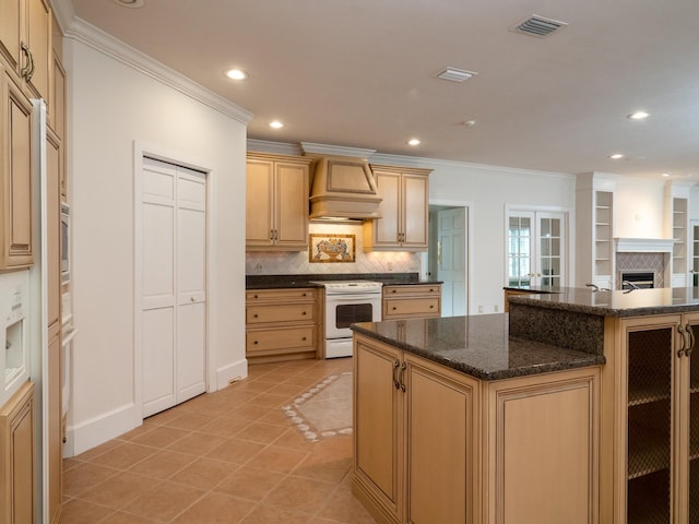 kitchen featuring a center island, light brown cabinets, premium range hood, tasteful backsplash, and white electric range oven