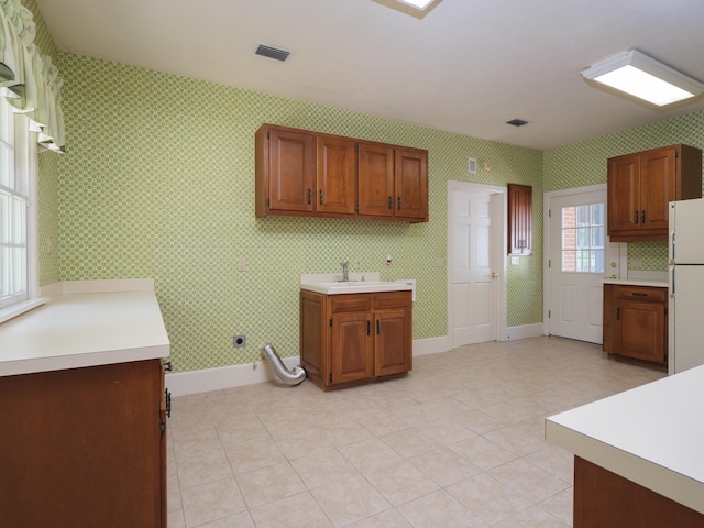 kitchen featuring sink and white refrigerator