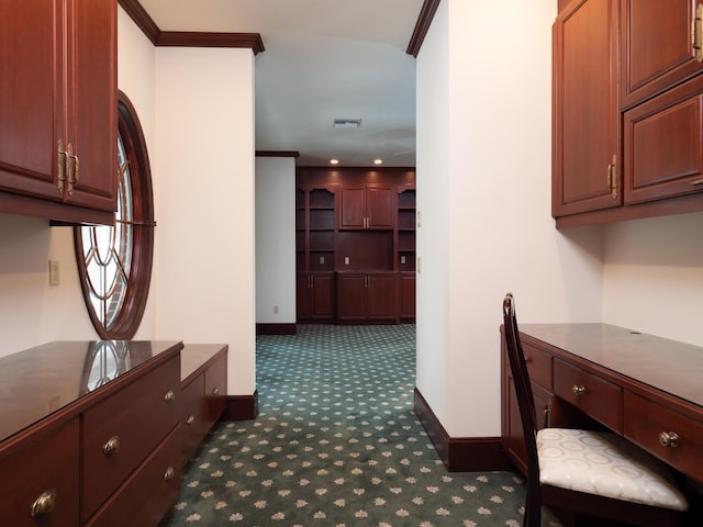 hallway featuring dark carpet and ornamental molding