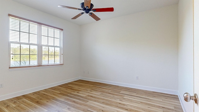 spare room featuring ceiling fan and light hardwood / wood-style floors