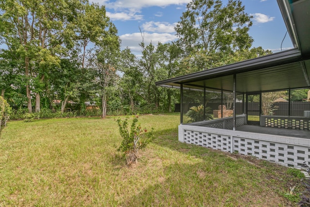 view of yard featuring a sunroom