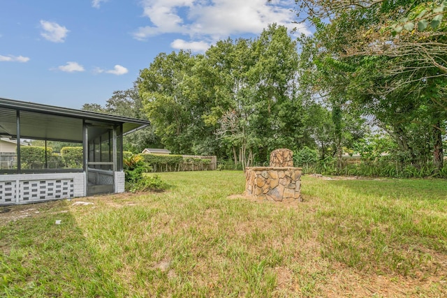 view of yard featuring a sunroom