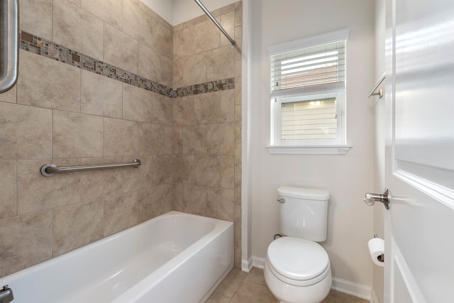 full bath featuring shower / bath combination, tile patterned flooring, toilet, and baseboards