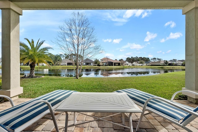 view of patio featuring a water view