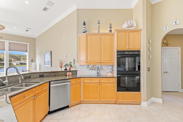 kitchen with stainless steel dishwasher, ornamental molding, double oven, sink, and dark stone countertops