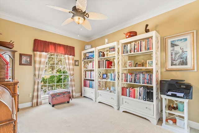 living area featuring crown molding, carpet, and ceiling fan