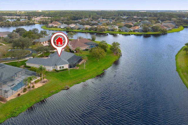 birds eye view of property featuring a water view