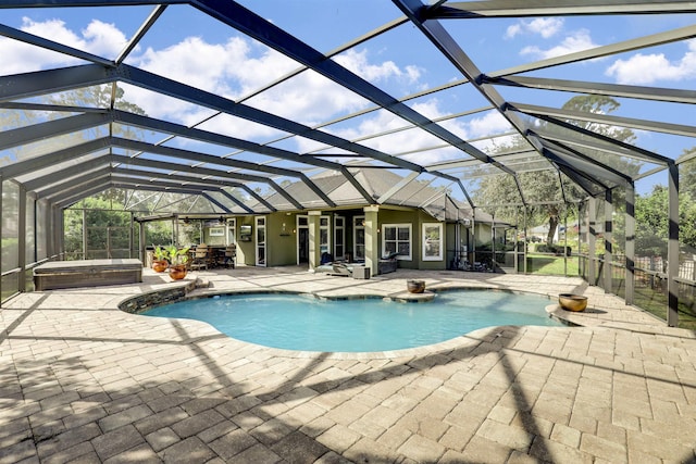 view of pool featuring a patio area and a lanai