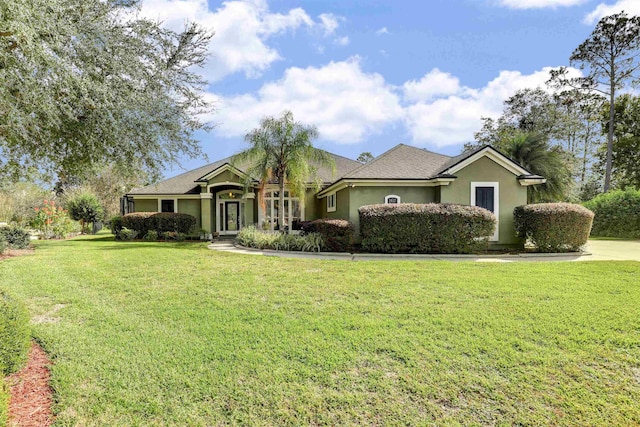 single story home with a front yard