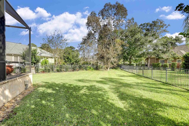 view of yard featuring a lanai