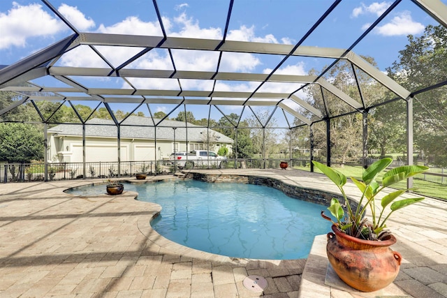 view of swimming pool with a patio and glass enclosure