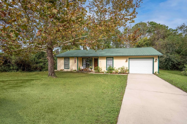 single story home featuring a front yard and a garage